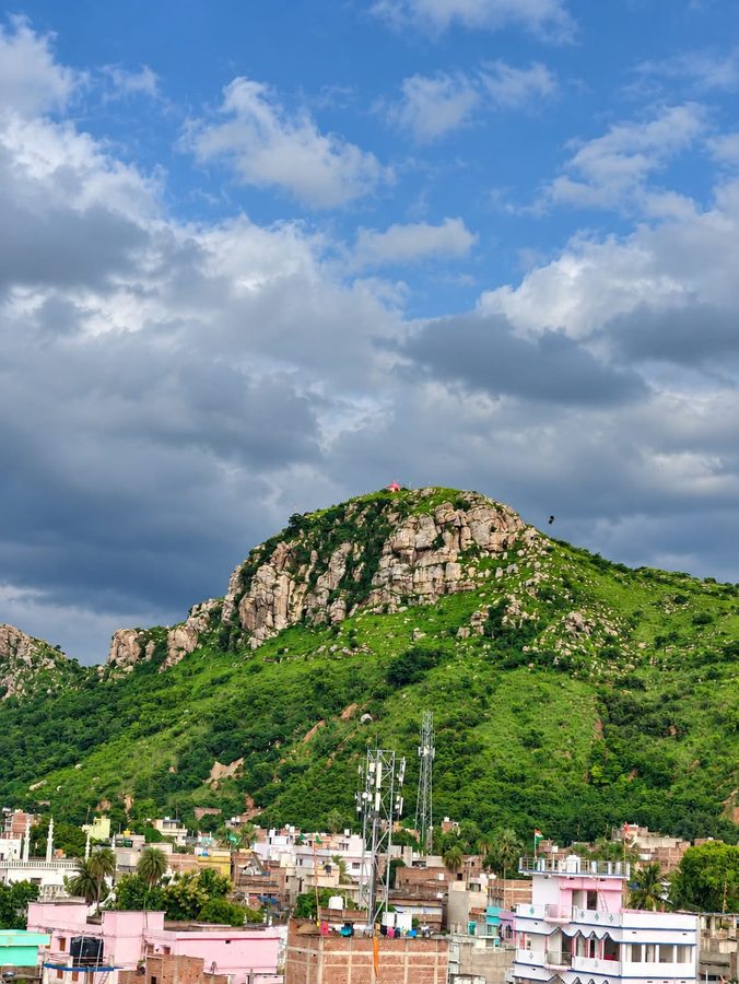 Hilltop temple overlooking Sheikhpura town under a dramatic sky
